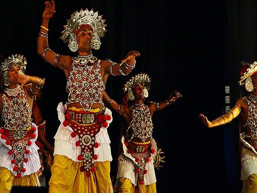 Kandyan dancers performing in traditional headdress